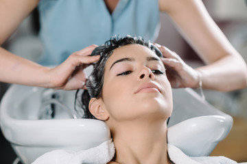 Obraz na płótnie Canvas Washing hair in hair salon