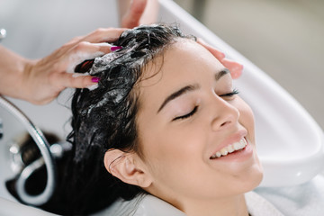 Naklejka premium Washing hair in hair salon