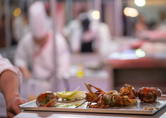 Chef preparing luxury menu lobster on tray
