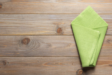 cloth napkin on at rustic wooden plank table