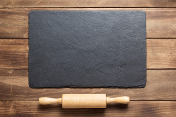 slate stone at rustic wooden plank board table