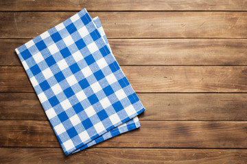 cloth napkin on at rustic wooden plank