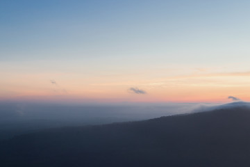 The sunrise view with mist on the mountian at Pha Mor E Dang, Khao Phra Wihan National Park, Thailand.