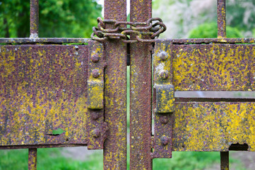 old iron gate closed with a chain