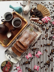 Walnut coffee cake. Along with decorations and coffee.