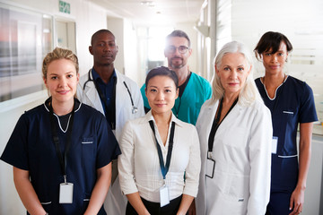 Portrait Of Medical Team Standing In Hospital Corridor