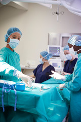 Surgical Team Working On Patient In Hospital Operating Theatre