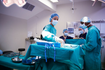 Surgical Team Working On Patient In Hospital Operating Theatre
