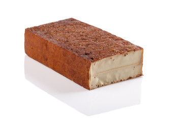 Smoked tofu isolated on white background. Close-up. Vegetarian food concept