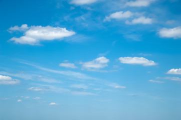 Obraz premium Blue clear sky with light white clouds.