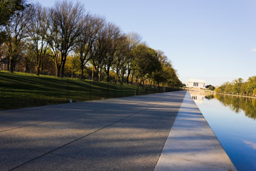 Autumnal vista of the ceremonial tree-lined boulevard including Elm Walks on the National Mall in Washington DC, leading westwards towards the Abraham Lincoln Memorial