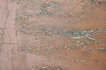 textured background of old boards covered with red dark cracked from old age paint