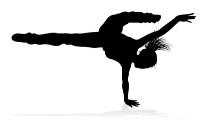 A woman street dance hip hop dancer in silhouette