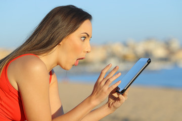 Surprised teen finding amazing content on tablet