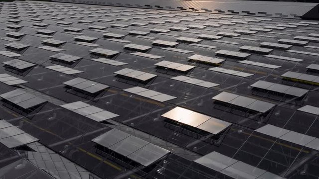 Rooftop Aerial of Big Agriculture Greenhouse Glass System Structure With Open Ventilation Windows