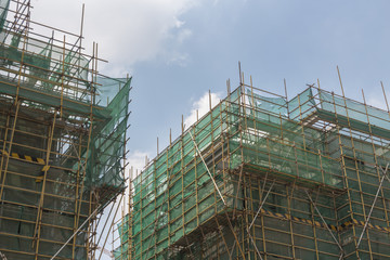 Construction protective exterior wall with scaffolding close-up