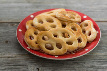 Sweet pretzels on a plate. Rustic style