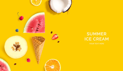 Ice cream cone with raspberry, blueberry, coconut, lemon, melon and watermelon. Flat lay. Food concept. Yellow background.