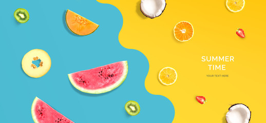 Creative layout made of summer fruits. Flat lay. Food concept. Macro concept. Watermelon, lemon, kiwi, melon, coconut, orange and strawberry on blue and yellow background.