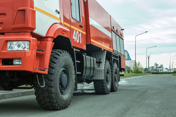 Red firetruck driving on a road