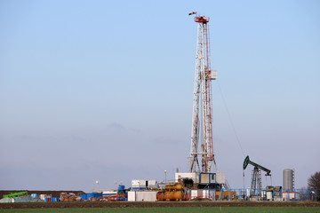 Oil and gas drilling rig and pump jack in oilfield industry