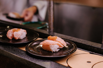 Conveyor belt sushi Japanese food Raw fish dishes