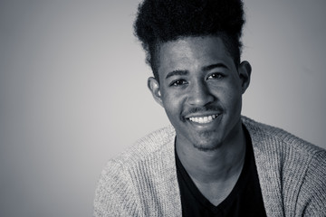 Fototapeta premium Fashion portrait of Attractive african american male model posing happy and sexy for the camera