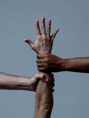 Conceptual image of people of different races together against racism and united for human rights