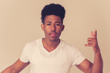 Human expressions and emotions. Young attractive man with an angry face, looking furious and crazy