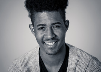 Fototapeta premium Fashion portrait of Attractive african american male model posing happy and sexy for the camera