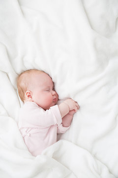 Baby Sleeping, 3 Months Old Kid In Pink Cloth Sleep On A White Blanket, Child Asleep In Bed