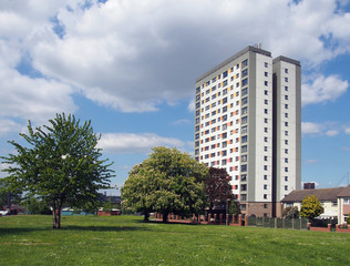 holbeck moor in leeds with with spring trees surrounded by housing on and a large public housing...