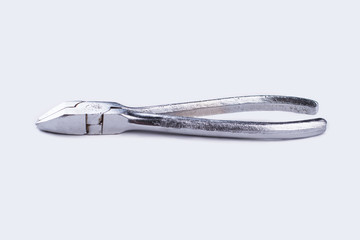 Silver pliers on a white background. Metal grips, horizontal image. Tool for repair.