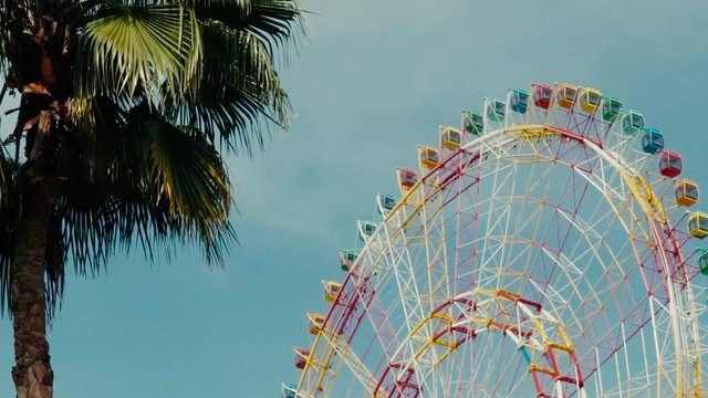 Design Layout or template for video editing. Mockup. A huge ferris wheel on a background of blue sky.