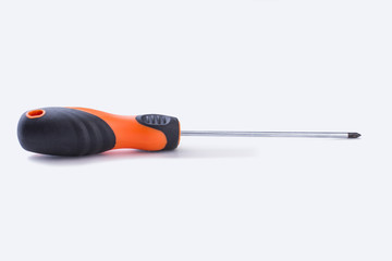 Screwdriver on white background. Orange screwdriver with rubber handle.