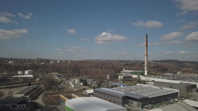 Gorlice, Poland - 3 9 2019: Industrial region of the Carpathian city. Top view of the refinery and auxiliary buildings. Video shot by drone or quadrocopter. Vanity of the day at the factory. Planning 