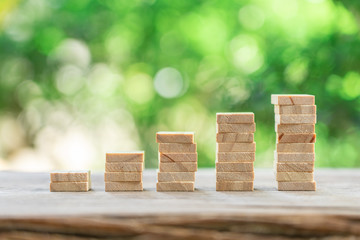 Money, Financial, Business Growth concept, stack of wood Investment Analysis Or investment. The concept of being the number one business in the world stands at its peak.