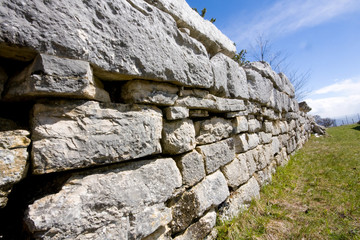 Pietrabbondante, Isernia, Molise, Italy - june 3 2019: megalithic walls of the Sannio. Archaeological area of the theater and Italic temple of Pietrabbondante.