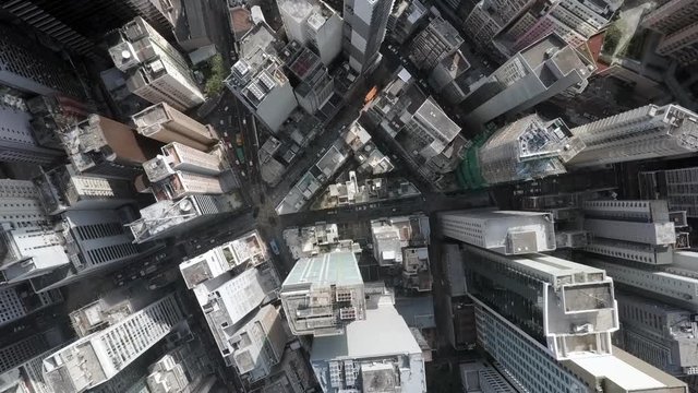 Slow Motion: Spinning Aerial Drone Shot of Triangular Building Rooftop - Hong Kong, China