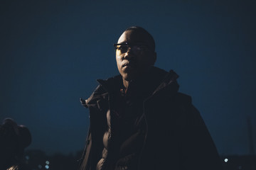 portrait of young african man posing outdoor and looking further
