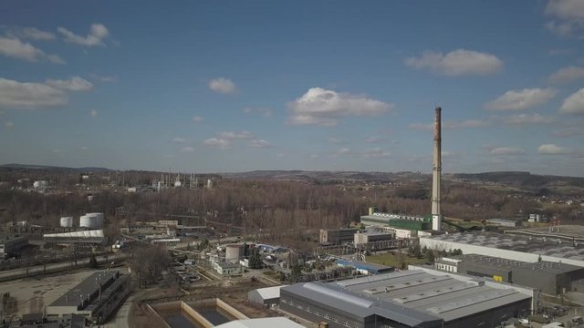 Gorlice, Poland - 3 9 2019: Industrial region of the Carpathian city. Top view of the refinery and auxiliary buildings. Video shot by drone or quadrocopter. Vanity of the day at the factory. Planning 