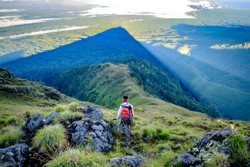 Trekking down in the shadow of Mount Rinjani's peak, Lombok, Indonesia