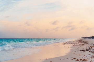 Fototapeta na wymiar Amazing beautiful sunset on an exotic caribbean seashore