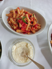 Italian pasta with tomato sauce, basil and Parmesan cheese.