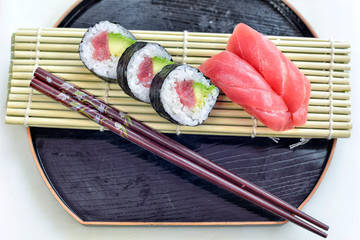 Detail of a plate with sushi and sashimi.