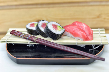 Detail of a plate with sushi and sashimi.