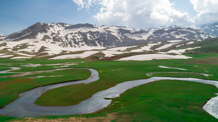 spectacular mystical mountains, snow waters and large streams