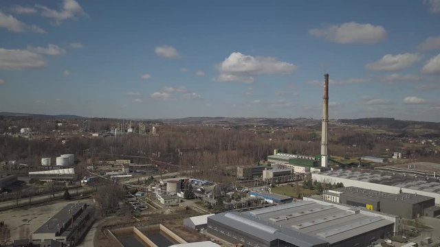 Gorlice, Poland - 3 9 2019: Industrial region of the Carpathian city. Top view of the refinery and auxiliary buildings. Video shot by drone or quadrocopter. Vanity of the day at the factory. Planning 