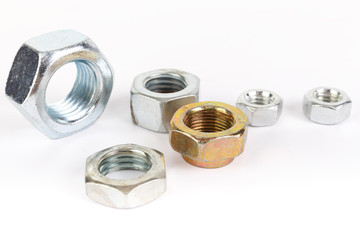 Steel nuts on a white background