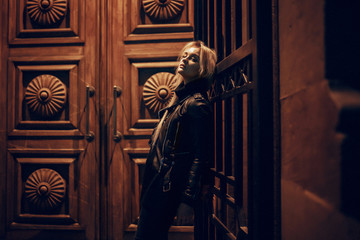 beauty woman posing over night illuminated street